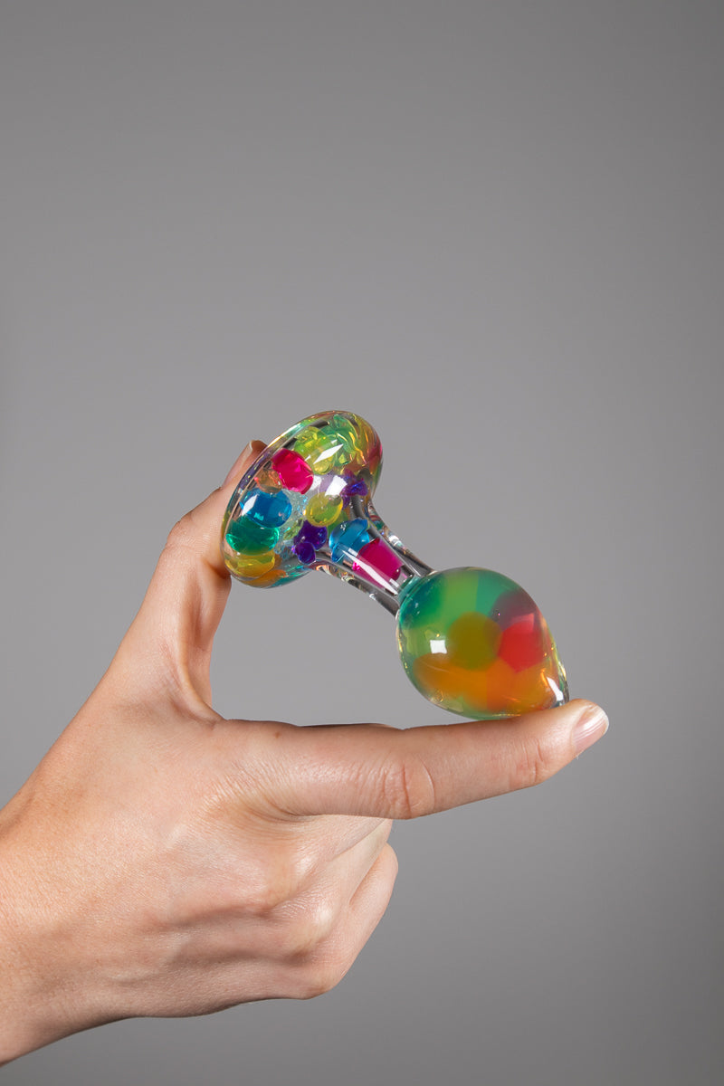 Crystal delights funfetti plug held between thumb and finger 