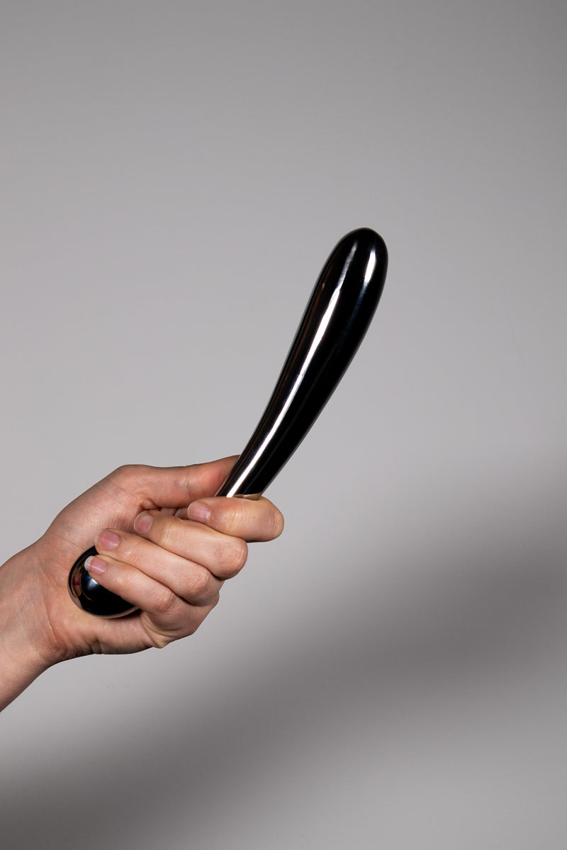 Double Fun Double Ended Dildo gripped by a hand at the base